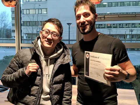 Kostis, holding his Vue.js 3 Deep Dive certificate, with Evan You, the creator of Vue and Vite, February 2020